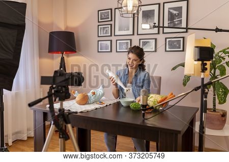 Vlogger Filming Video About Introducing Soft Food To Baby Nutrition And Preparation Of Fresh Fruit A