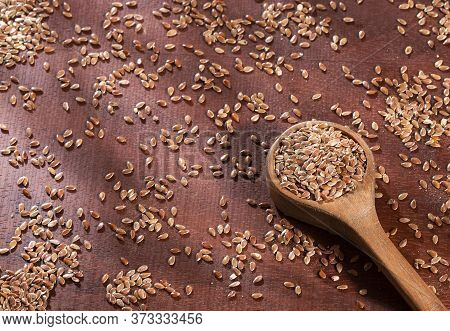 Linseed Organic Seeds - Linum Usitatissimum. Wood Background