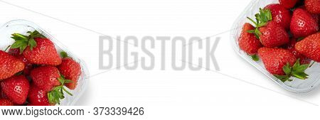 Two Plastic Container Boxes Of Ripe Strawberries Standing On The Edge Of Photo Isolated On Clean Whi