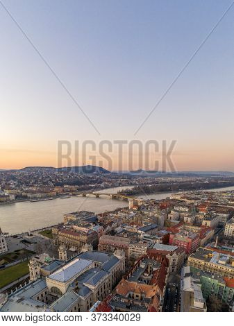 Aerial Drone Shot Of Margaret Bridge Over Danube River In Budapest Sunset Hour