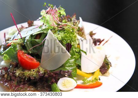Salad With Goat Cheese. Salad With Goat Cheese, Quail Eggs And Herbs.