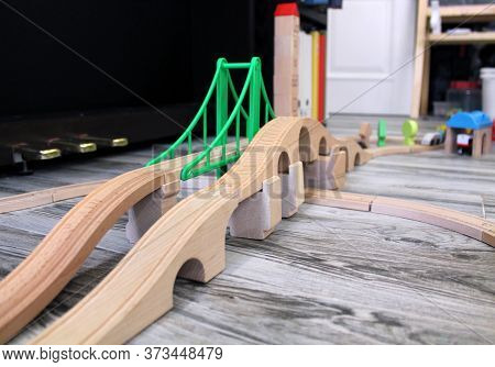 Bridge And Elements Of A Toy Wooden Railway In The Game Room. Wooden Road, As A Means For Playing At