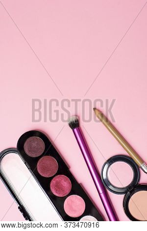 Cosmetics Is On The Pink Backgroud. Makeup In Close View. Concealer, Brush, Eyeshadow Are On The Bac