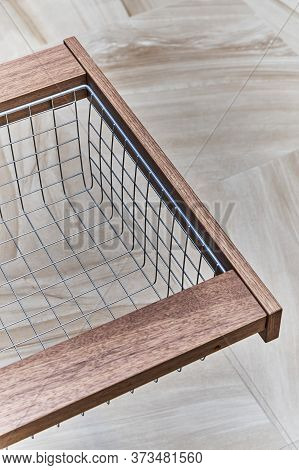 Storage Organization. Metal Mesh Basket In Wooden Drawer In Food Storage Room
