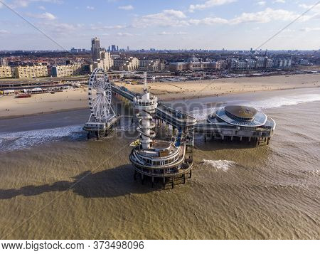 Pier With Ferris Wheel At Northern Sea Scheveningen Beach , Located Near The Hague City Aerial Drone
