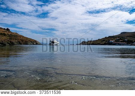 Luxury Yacht Moored In The Middle Of The Blue Transparent Calm Sea