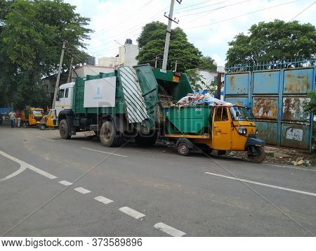 Closeup Of Bbmp Garbage Collecting Lorry And Auto Parking On Roadside