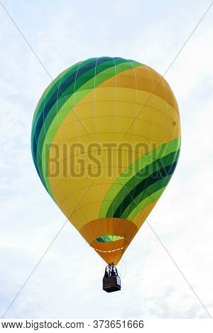 Green Yellow Ballon Rising To Sky. European Balloon Festival In Spain, Igualada.