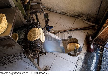 Tortillas Stacked On A Tortilla Machine