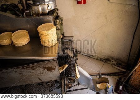 Tortillas Stacked On A Tortilla Machine