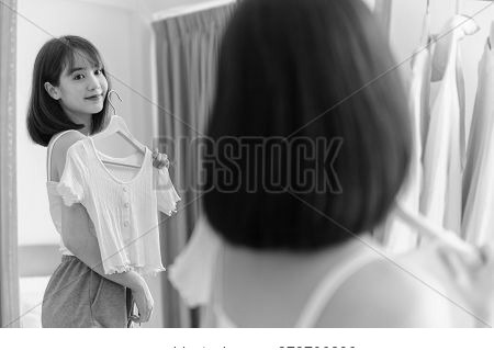 Asian Woman Make Up And Dress-up At Home. Lifestyle In The Bedroom. Social Distancing And Self-quara