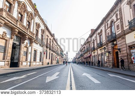 Morelia, Michoacan, Mexico - November 24, 2019: View Down Mexico 15, With People Riding Bikes And Ru