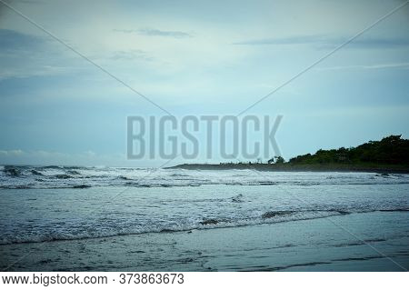 Playa El Cuco Is A Quintessential El Salvador Beach Town. Its Dark Sands Are Lined With Vendor Huts 
