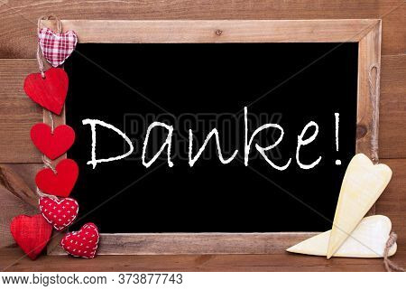 Balckboard With Heart Decoration, Text Danke Means Thank You