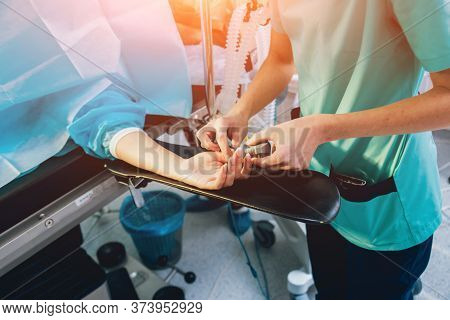 Pulse Oximeter On The Patients Hand. Surgery Equipment.