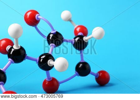 Molecule Of Vitamin C On Light Blue Background, Closeup. Chemical Model