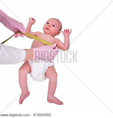 Doctor Measures The Growth Of A Newborn Baby, Isolated On A White Background. A Nurse In Uniform Che