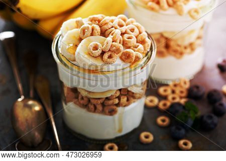 Yogurt Parfait With Cereal, Banana And Maple Syrup