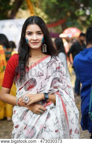 Portrait Of A Pretty Young Indian Woman Wearing Traditional Saree And Jewellery With Spring Festive 