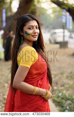 Portrait Of A Pretty Young Indian Woman Wearing Traditional Saree And Jewellery With Spring Festive 