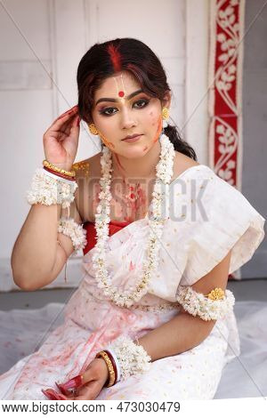 Portrait Of A Pretty Young Indian Woman Wearing Traditional Saree And Jewellery With Spring Festive 