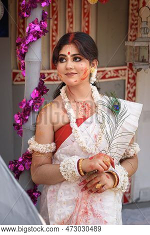Portrait Of A Pretty Young Indian Woman Wearing Traditional Saree And Jewellery With Spring Festive 