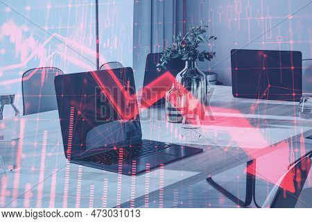 Close Up Of Laptop On Coworking Office Desktop With Red Candlestick Arrow Going Down On Blurry Backg