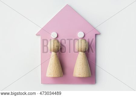 Family Health Concept. Pills, A Wooden House And Wooden Men. A Single Dose Of Potassium Iodide. Prot