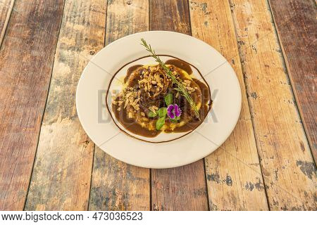 Spanish Recipe For Timbale Of Oxtail With Spices And Mashed Potatoes With Sauce
