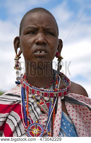 Africa, Kenya, May, 2016 - Portrait Native Maasai Tribe Woman Sells Ornaments Made Of Beads. The Maa
