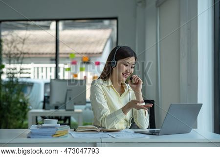 Close Up Call Center Operator In Wireless Headset Talking With Customer, Woman In Headphones With Mi