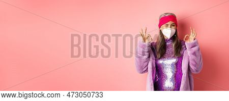 Covid-19, Pandemic And Fashion Concept. Awesome Asian Grandmother Wearing Stylish Disco Dress And Re
