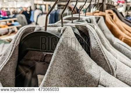 Gray Woolen Coats Hanging On Clothing Rack For Sale In Fast Fashion, Mass Market Clothing Store At S