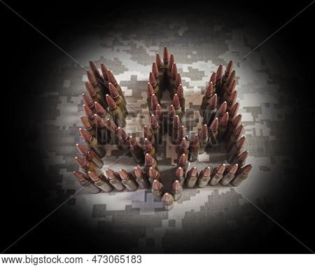 Coat Of Arms Of Ukraine Laid Out From Cartridges On Background Of Camouflage Clothing. Cartridges Fo