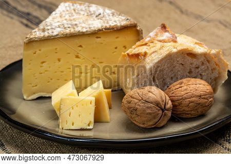 Pieces Of Cheese Tomme De Montagne Or Tomme De Savoie Made From Cow Milk In French Alps Close Up
