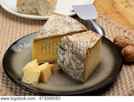 Pieces Of Cheese Tomme De Montagne Or Tomme De Savoie Made From Cow Milk In French Alps Close Up