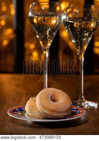Glass Of Brut Champagne Bubbles Wine In Tulip Glass And Glazed, Yeast-raised, American-style Ring Do