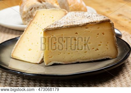Pieces Of Cheese Tomme De Montagne Or Tomme De Savoie Made From Cow Milk In French Alps Close Up