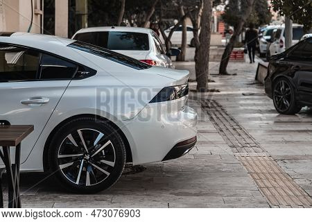 Side , Turkey -  January  29, 2023:  
White Kia K5, Closed Trunk, Bumper, Trunk Lid, Rear Lights