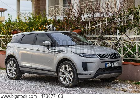 Side, Turkey - February 04 2023: Silver  Range Rover Evoque   Is Parked  On The Street On A Warm Sum
