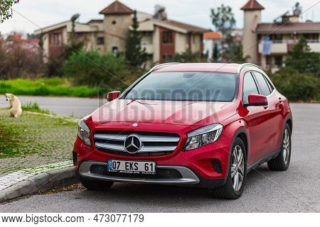 Side, Turkey - February 04 2023:         Red  Mercedes-benz Gla  Is Parked  On The Street On A Warm 