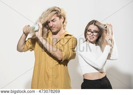 Messy Hair. Couple Of Young Woman And Man With Messed Hairs. Bad Frizzy Hair. Two People Having Bad 