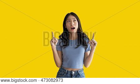 Asian Woman Pointing Finger Inviting Click Here, It Is Recommended To Follow This Direction Or Click
