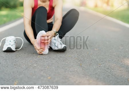 Young Adult Female With His Muscle Pain During Running. Runner Woman Having Leg Ache Due To Plantar 