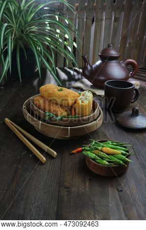 Delicious Indonesian Chicken Ragout Risoles On A Rustic Table