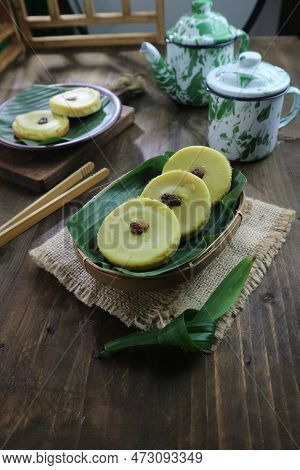 Indonesian Sweet Pancakes With Raisins On A Rustic Table