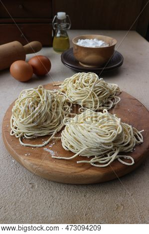 Homemade Noodles With Egg, Flour And Rolling Pin On Wooden Board