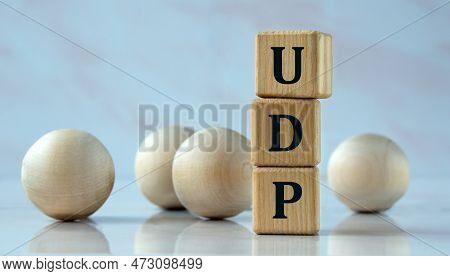 Udp (user Datagram Protocol) - Acronym On Wooden Cubes On The Background Of Light Balls. Internet Co