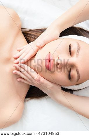 Cosmetic Massage Of The Face And Neck Area. Cosmetic Skin Care To Improve Blood Circulation. Firming