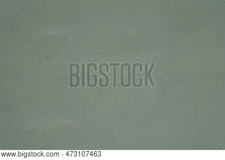 Surface Of Dark Subdued Green Painted Wall With Cracks